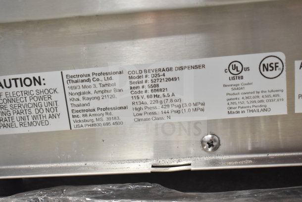 Tag on Crathco D25-4 beverage dispenser showing model number, serial number, 115V, 5.5A power details, and NSF certification.