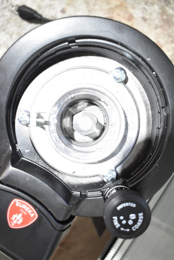 Brand new Conti Valerio Zenith Touch Eureka bean grinder, 110-120V, showing grinding adjustment knob.