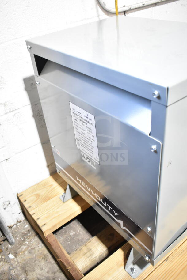 Emerson EE5H45S transformer, heavy duty, new with scratches and dents, label shows model and specs, mounted on a pallet.