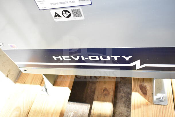 Brand new Emerson EE5H45S transformer, heavy duty, scratch and dent condition, Hevi-Duty label visible.
