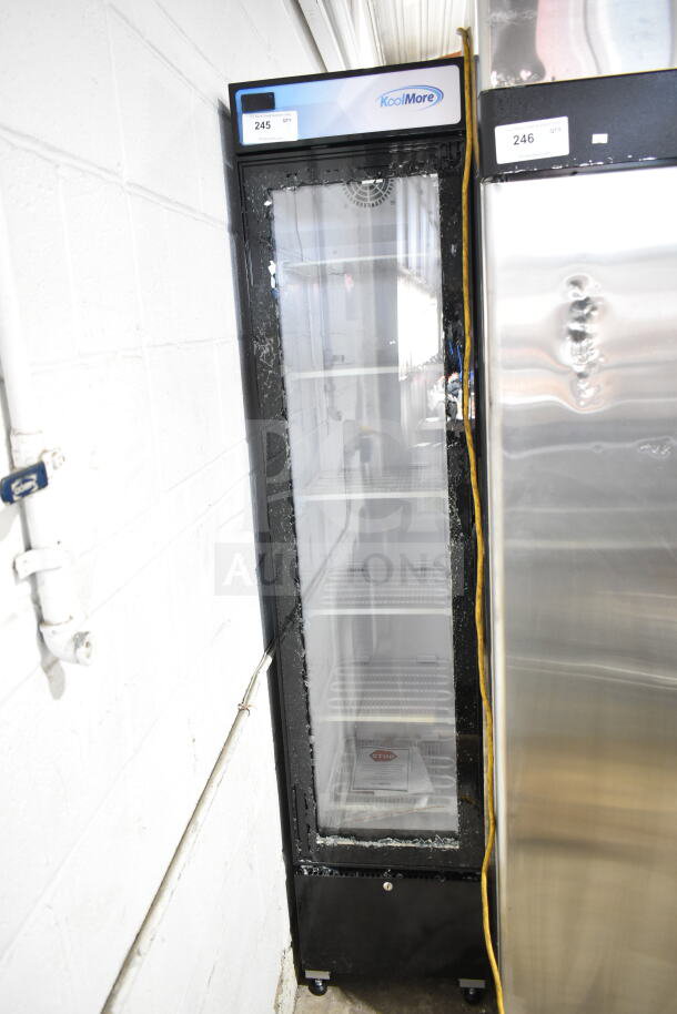 Brand new KoolMore KM-MDF-17S commercial freezer merchandiser with single glass door, scratch and dent, visible glass damage.