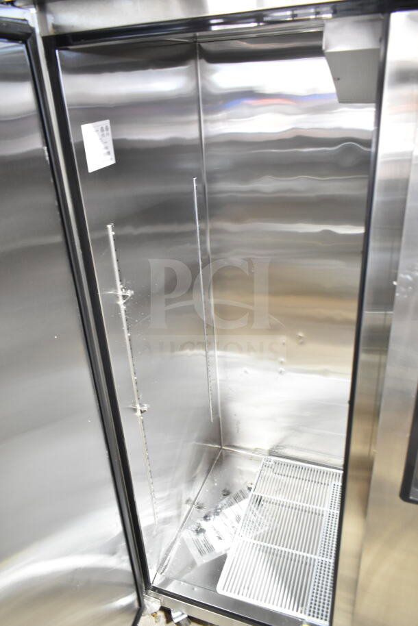 Brand new Migali C-3F commercial 3-door reach-in freezer, visible interior detail, 115/208-230 Volts, 1 Phase, serial C-3F00319112800920002.