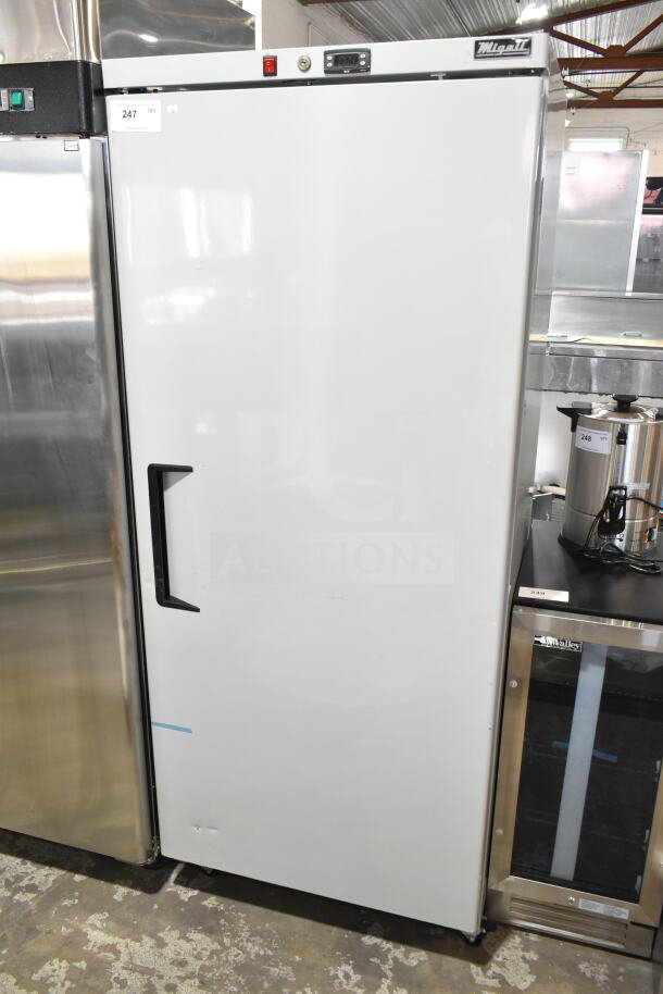 Brand new KoolMore SR60V commercial single door reach-in freezer, 115 volts, minor scratches and dents visible.
