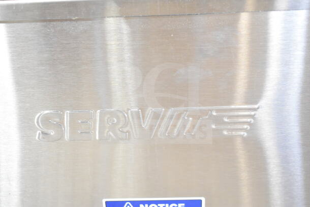 Metal surface with embossed ServIt logo from the 2025 ServIt 423FW200D electric food warmer.