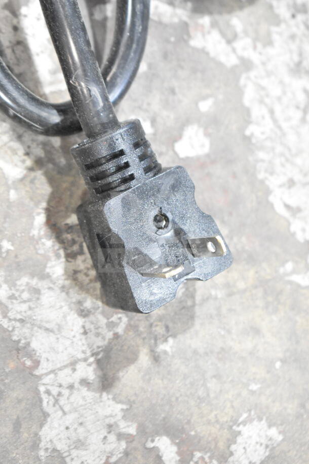 Close-up of a power plug attached to the 2025 ServIt 423FW200D dual well food warmer.
