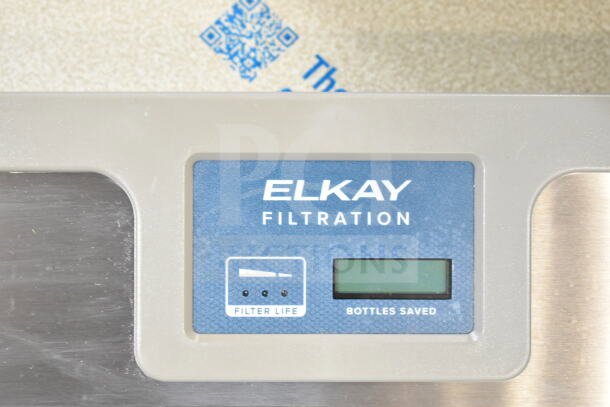Elkay ENKLZS8WS_1A 8 GPH light gray hands-free filtered bottle filling station panel displaying filter life and bottles saved.