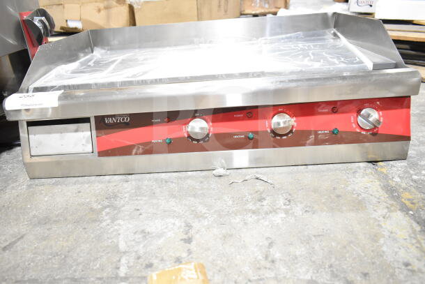 Brand new Avantco 177EG30N 30" electric countertop griddle, 208/240 volts, 1 phase, visible control dials, slight scratches.