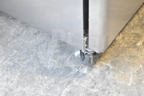 Brand new Migali C-1F-LHH-HC commercial freezer, single door, scratch and dent, 115V, 1 phase, with casters.