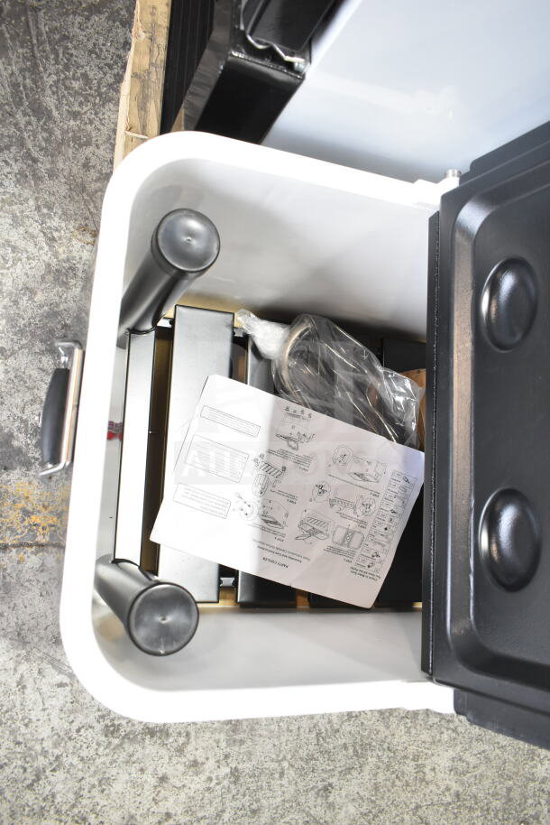 Choice 100 Qt. stainless steel beverage cooler interior with assembly parts and instruction manual in new condition.
