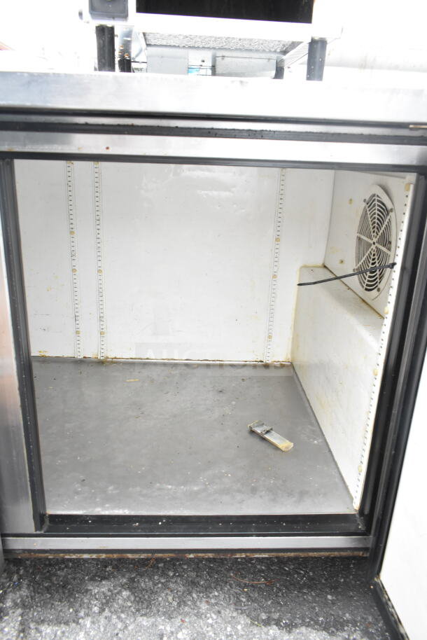 True TWT-60-32 2 Door Work Top Cooler, interior view, used condition, visible fan, 115V, 1 Phase; spacious stainless interior.