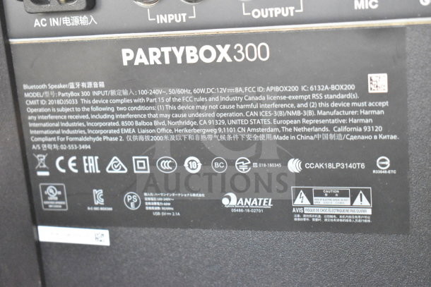 JBL Partybox 300 speaker label showing model number, FCC compliance, and manufacturing details.