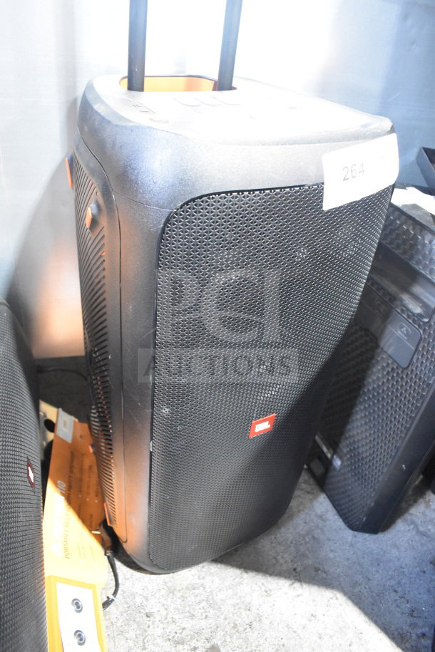 JBL Partybox 310 Speaker, large black portable speaker, sturdy black grille, JBL logo, retractable handle, good condition.