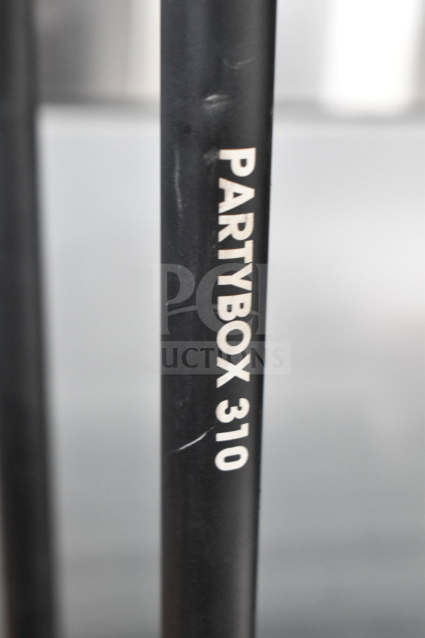 JBL Partybox 310 Speaker stand with visible "Partybox 310" label, showing some minor wear.