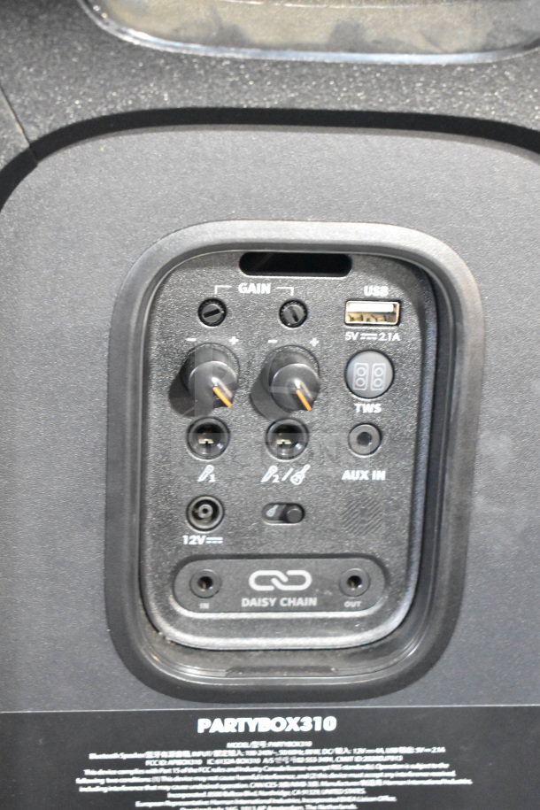 JBL Partybox 310 speaker, rear panel showing gain controls, USB, AUX-IN, and daisy chain ports, in good condition.