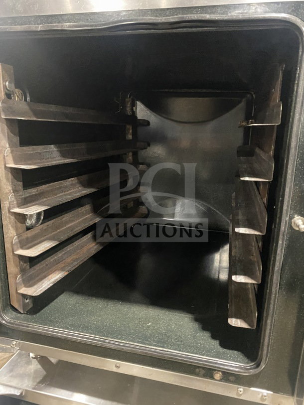 Commercial Turbofan E32D5 convection oven interior, stainless steel, double stacked, steam injection, on casters.