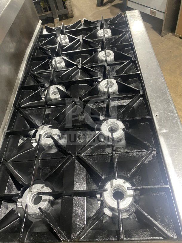 Wolf commercial stainless steel 8-burner range, natural gas, double oven, model C56D538. Features backsplash, overhead salamander shelf.