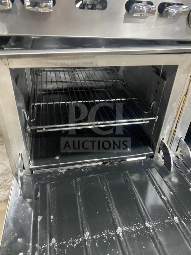 Wolf Commercial Stainless Steel 8-Burner Range & Double Oven Combo with overhead shelf. Model C56D538, SN 656011423.