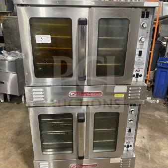 Southbend commercial stainless steel double stacked convection oven with thermostatic control and wired oven rack.