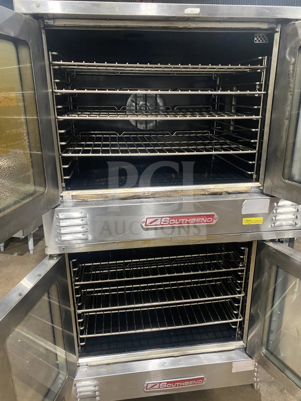 Southbend commercial stainless steel double stacked convection oven with thermostatic control, includes wired oven rack, on legs.