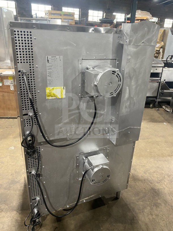 Southbend commercial stainless steel double-stacked gas convection oven, thermostatic control, with wired rack, on legs.
