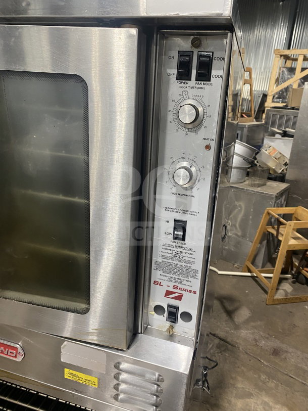 Southbend commercial stainless steel double convection oven, gas-powered, thermostatic control, wired rack, on legs.