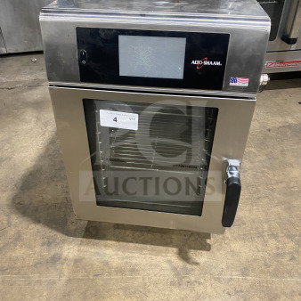 Alto-Shaam CTX4-10EC stainless steel convection combi oven with touchscreen, wired rack, 208-240V, 3 phase, on legs.