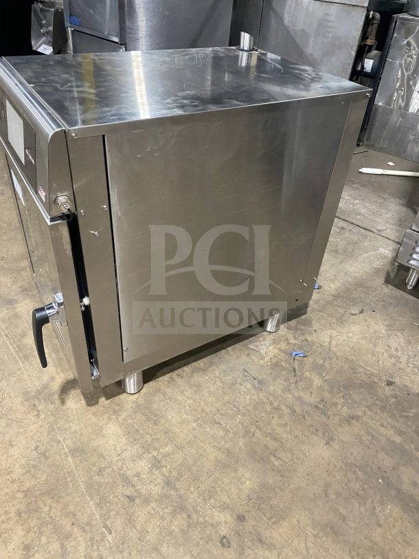 Alto-Shaam CTX4-10EC commercial stainless steel convection combi oven, touchscreen controls, wired rack, 208-240V, 3 Phase.