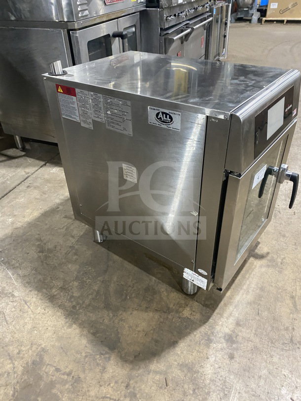 Alto-Shaam Combitherm CTX4-10EC stainless steel convection oven, countertop, touchscreen, wired rack, on legs, 208-240V, 3 phase.