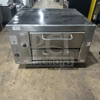 Attias commercial stainless steel gas-powered double deck pizza oven, countertop model, with dual controls and visible labels.