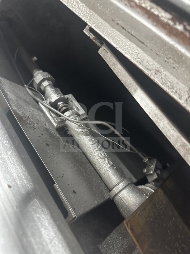 Attias commercial stainless steel gas-powered countertop double deck pizza oven, detail of internal components.