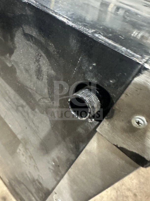 Alt text: Attias stainless steel gas-powered countertop double deck pizza oven, shown from a close-up angle.