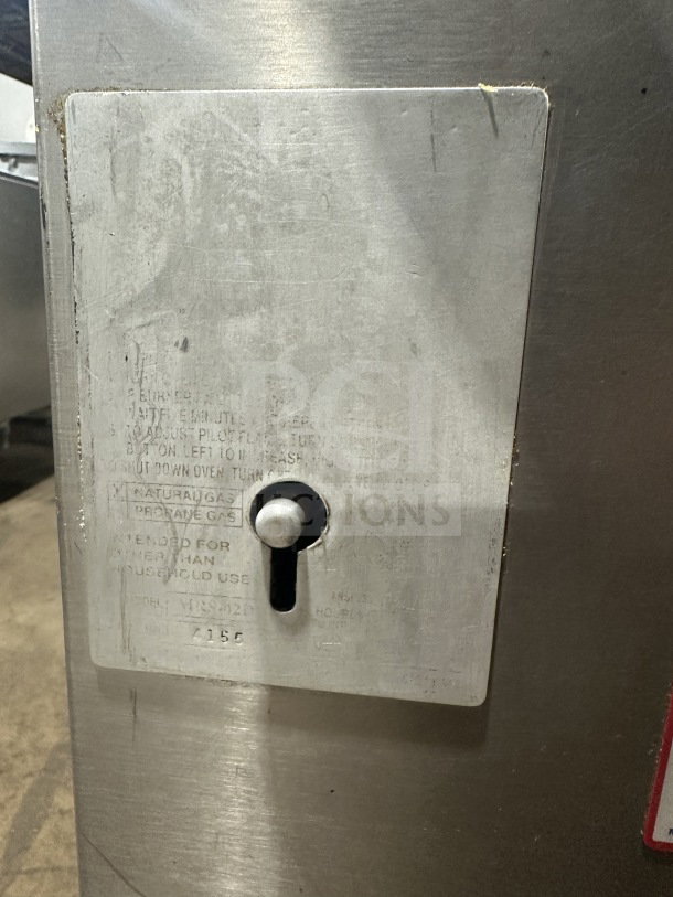 Attias stainless steel gas-powered double deck pizza oven, commercial countertop model, visible controls and markings on panel.