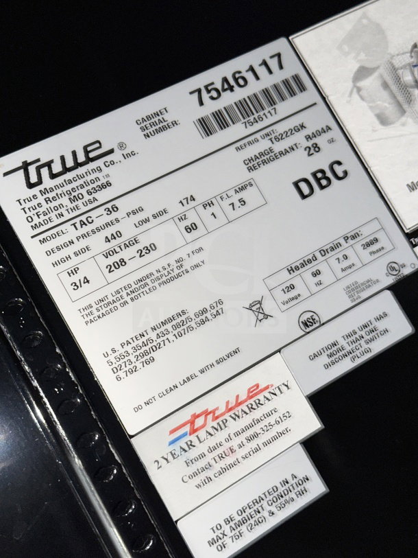 True TAC-36 Grab-N-Go Merchandiser, SN: 7546117, 208-230V, with pull-down night curtain, warranty label visible.