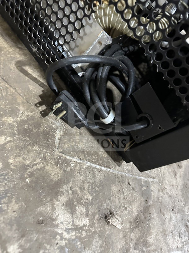 Power cord of True TAC36 refrigerated display case, black mesh ventilation, 208-230V, showcasing plug and cable.