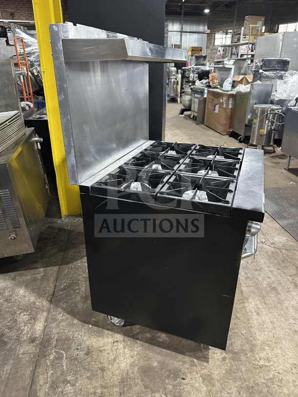 Qualite Commercial Stainless Steel Range/Oven Combo with backsplash, overhead salamander shelf, and casters. Model QLG36NG.