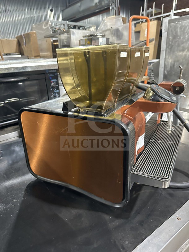 Thermoplan Mastrena II M2CS espresso machine, stainless steel, with drip tray, 3 bean hoppers, model shown in used condition.