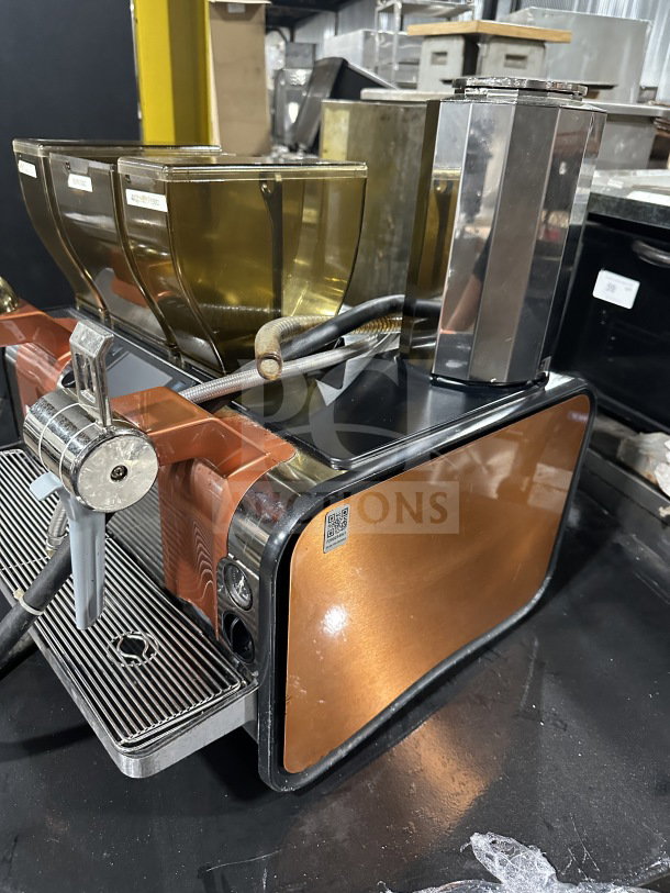 Thermoplan Mastrena II Model M2CS commercial espresso machine with copper finish, drip tray, and three bean hoppers.