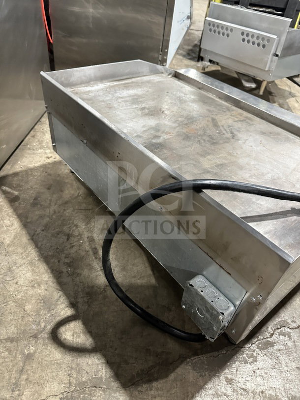 Commercial stainless steel electric flat griddle with thermostatic controls, model SR-EG36, 36", with back and side splash.