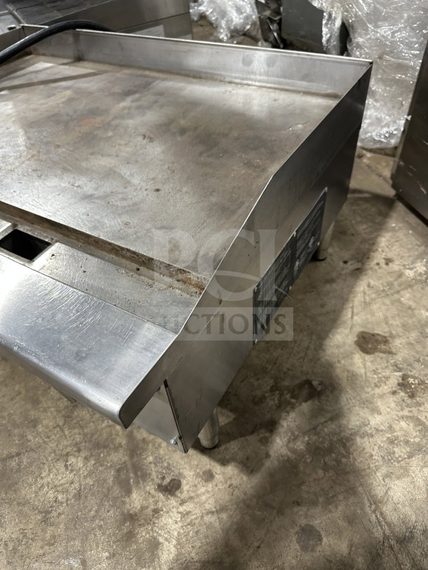 Standard Range 36" commercial stainless steel electric griddle, model SREG36, with thermostatic controls, back and side splash, on legs.
