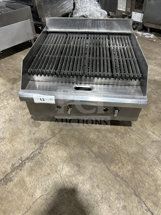 Commercial stainless steel charbroiler, model TMRC36. Countertop, radiant heat, gas and electric powered. Good condition.