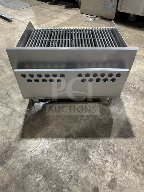 Commercial stainless steel countertop radiant charbroiler, Model TMRC36, gas and electric powered, in good condition.