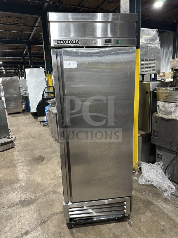 Maxx Cold stainless steel single door reach-in freezer/refrigerator with poly-coated wired rack and casters, in good condition.