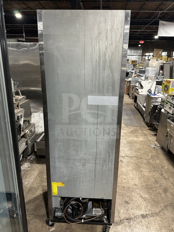 Maxx Cold commercial stainless steel single door freezer/refrigerator with poly coated wire rack on casters, slight wear.