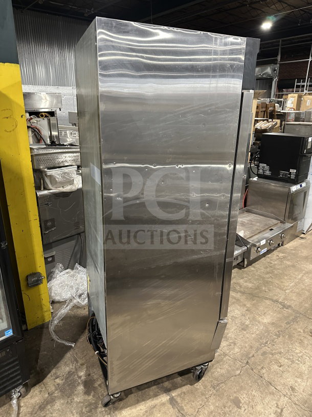 Maxx Cold commercial stainless steel single-door reach-in freezer/refrigerator on casters, with poly-coated wired rack.