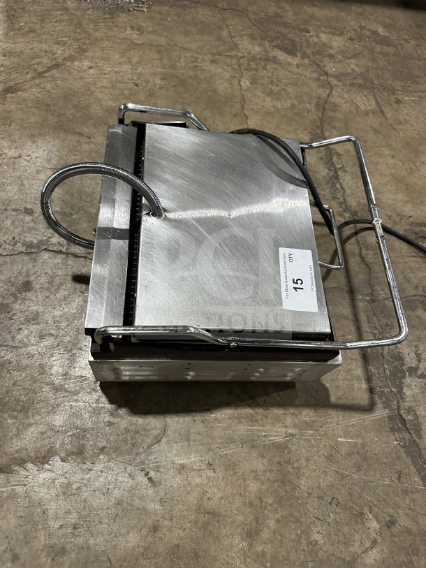 Cecilware SG1LG120 commercial stainless steel panini press with grooved grates, side handles, and thermostatic control.