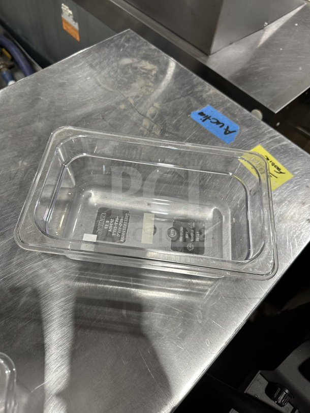 Winco SP7404 clear polycarbonate food pan, 1/4-size, 4" deep, brand new, durable commercial-grade, visible labels.