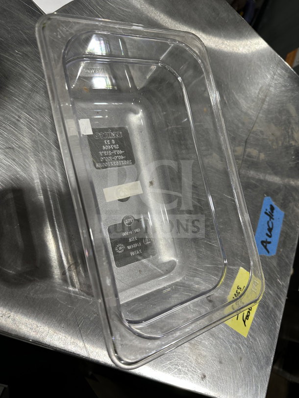 Winco SP7404 1/4-size clear polycarbonate food pan, 4" deep. Brand new condition, model markings visible at base.