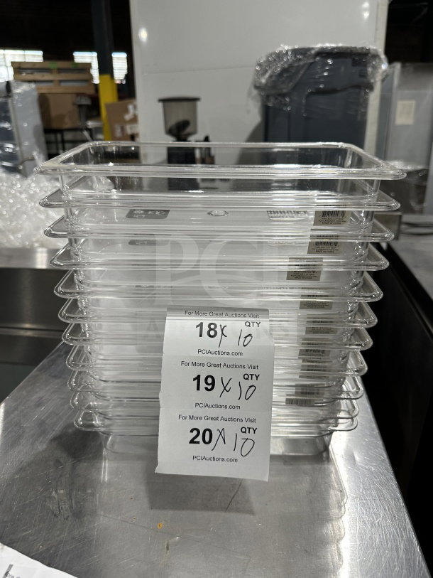 Clear Cambro Camwear Series 1/3 size food pans, model 32CW, 2.5" deep, stacked. Labels indicate auction lots.