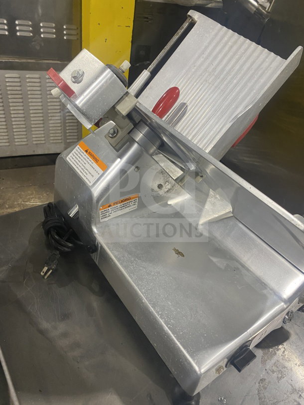 Berkel 827-A commercial deli meat slicer, electric, stainless steel, countertop model, visible warning labels, corded.