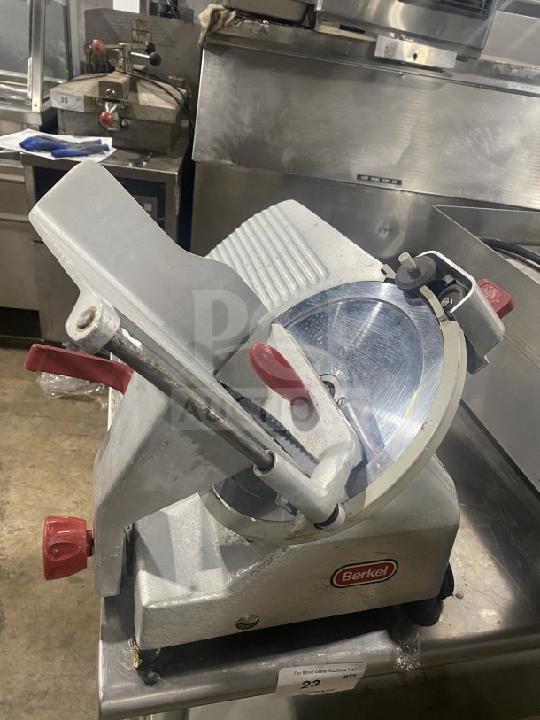 Berkel 827-A stainless steel deli meat slicer, electric, countertop model on legs, 115V, SN: EN-1005977, used condition.